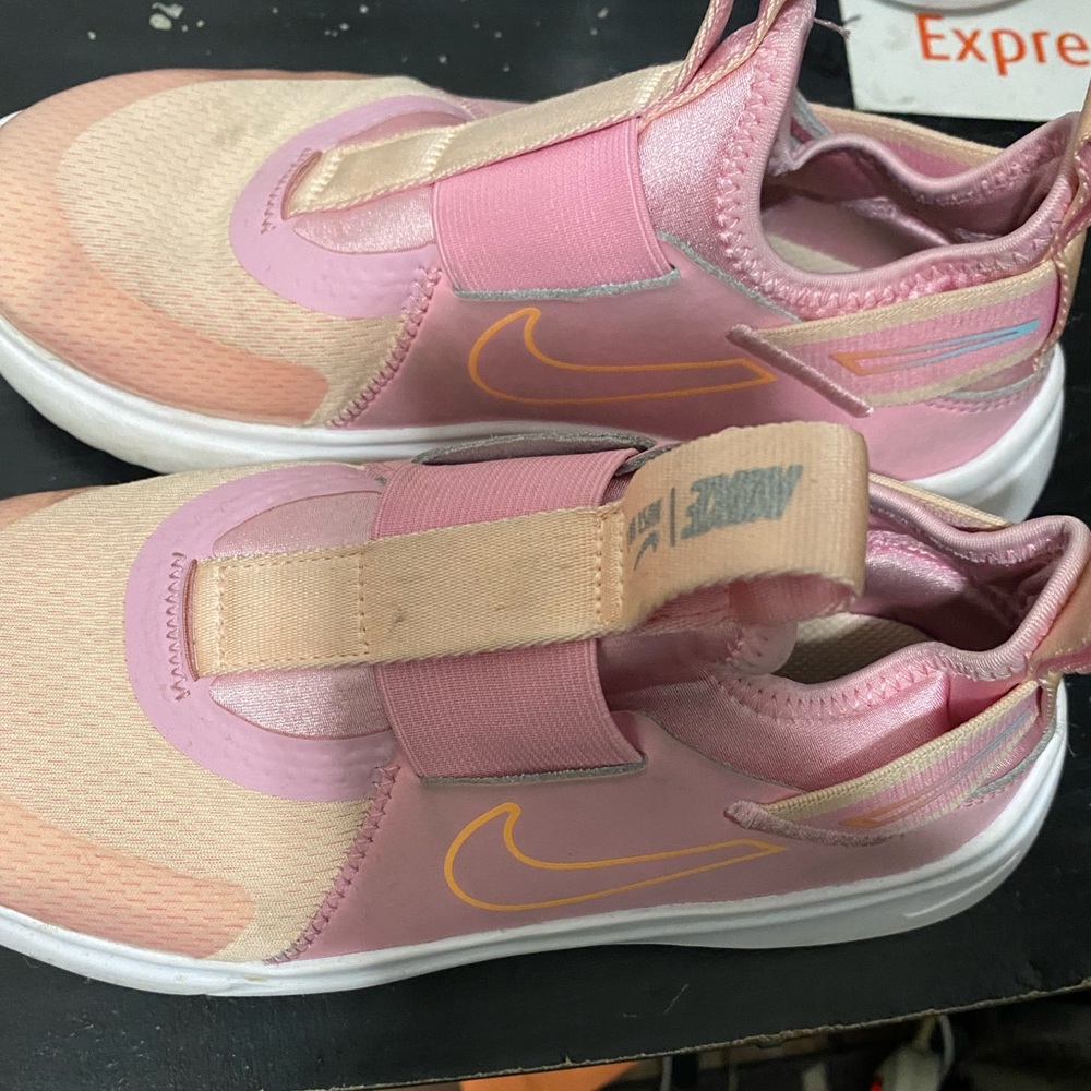 Girls pink Nike slip on sneakers
